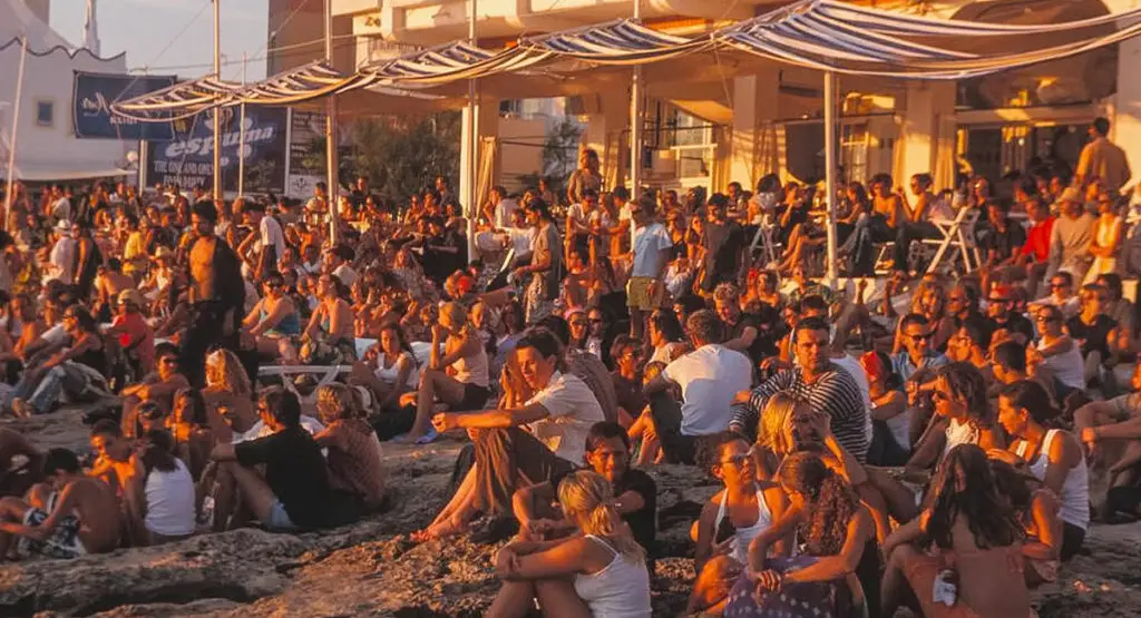 people watching the sunset at cafe del mar